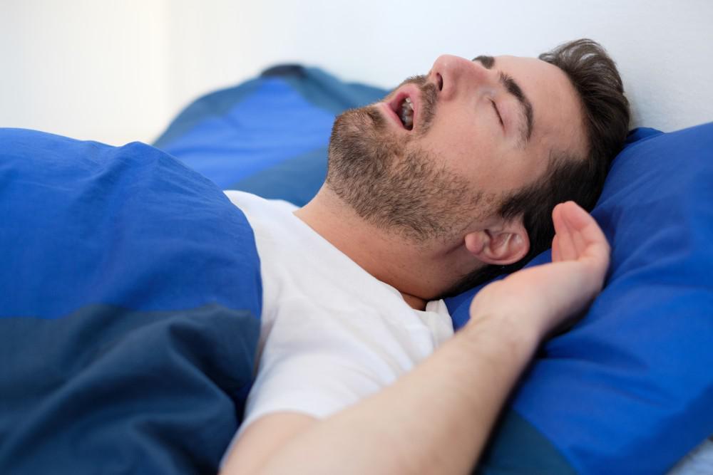 Someone lying awake at night, unable to sleep