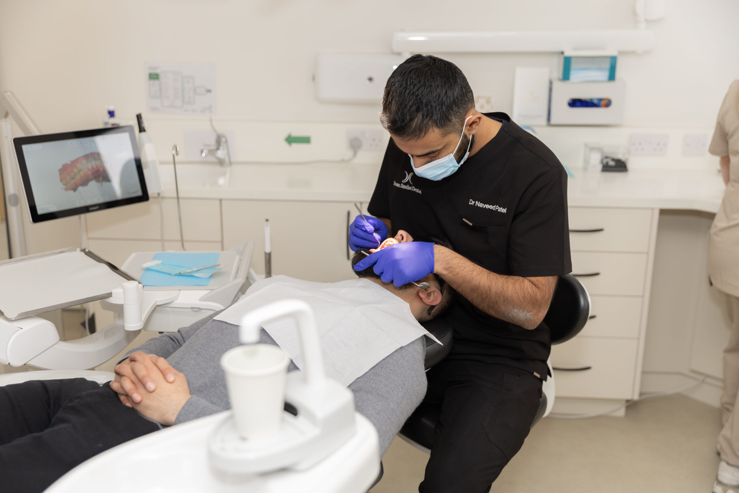 Dentist fitting a dental crown for a patient at Dream Smiles Dental in Bolton