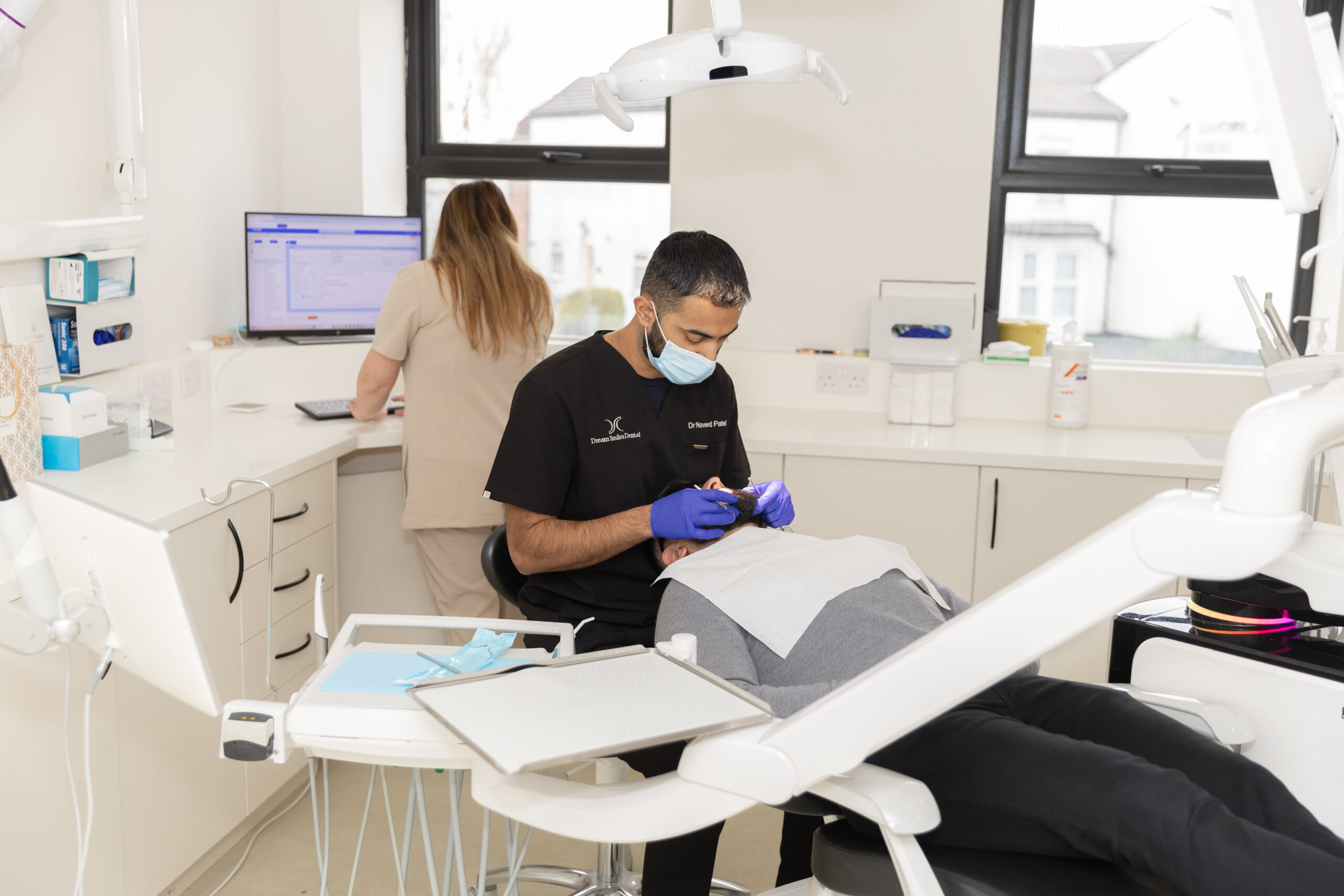 Emergency dentist treating a patient at Dream Smiles Dental in Bolton