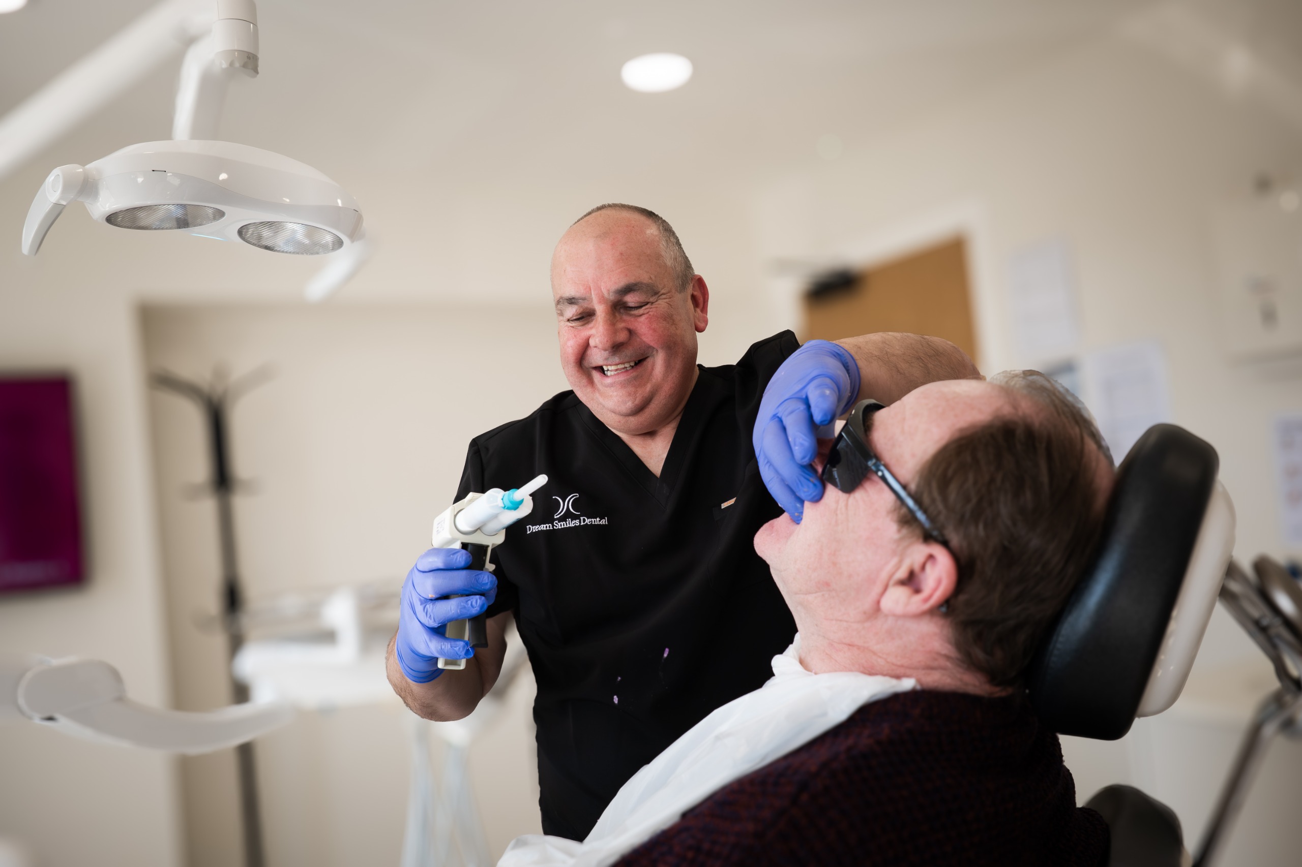 John Wibberley with a patient at Dream Smiles Dental