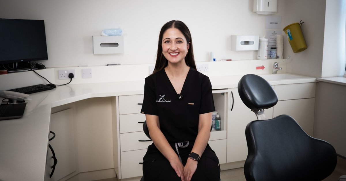 Dr Brekhna seated in a treatment room at Dream Smiles Dental in Bolton